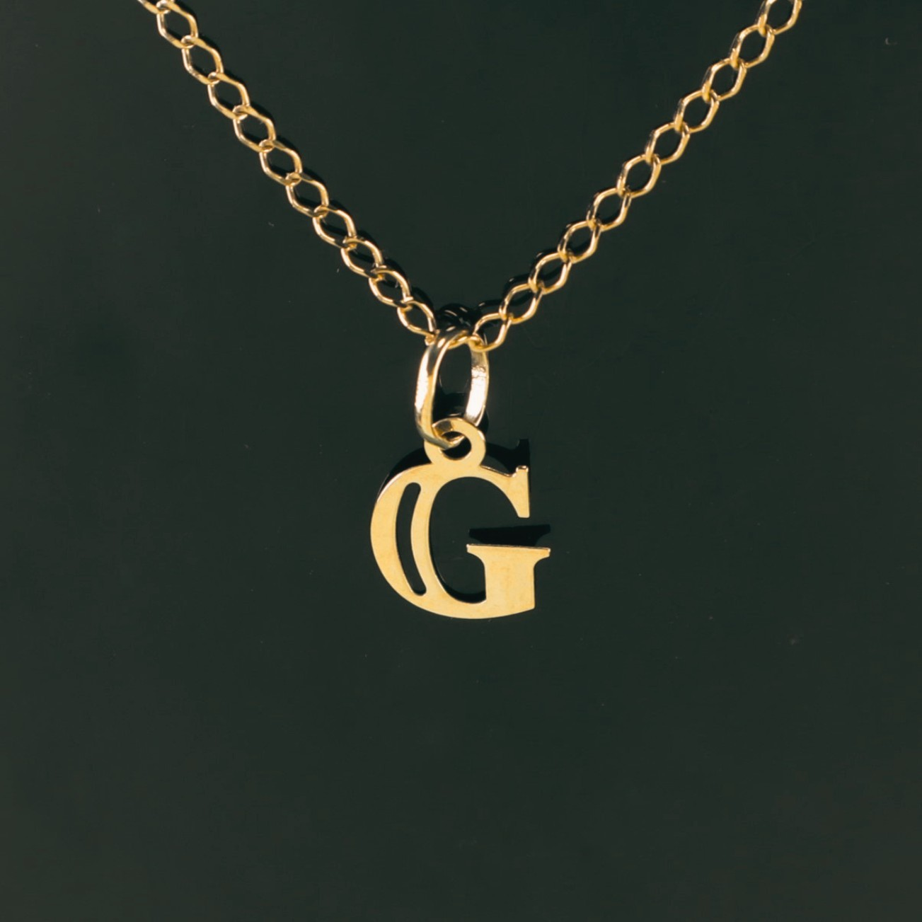 Colgante Inicial G 18K