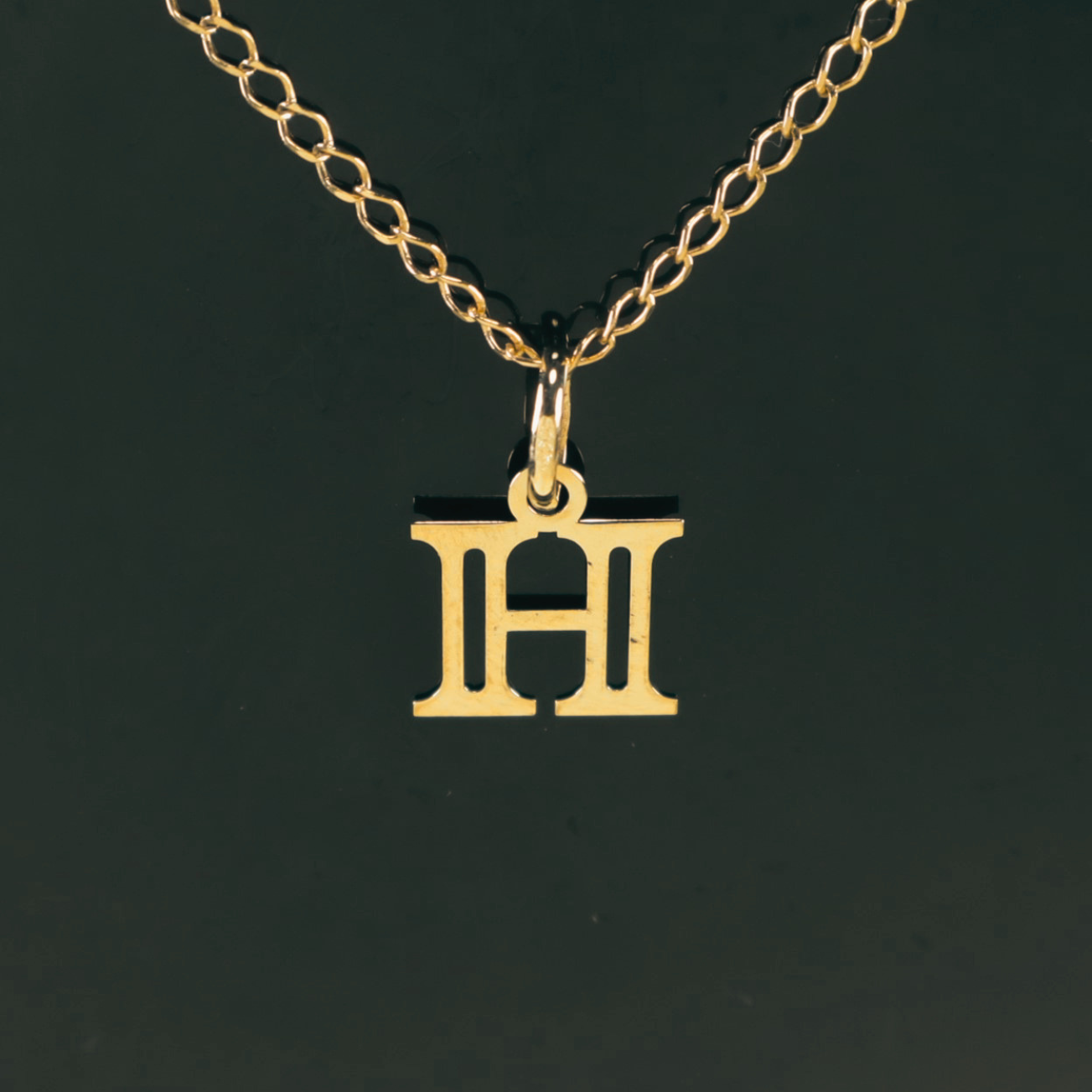 Colgante Inicial H 18K